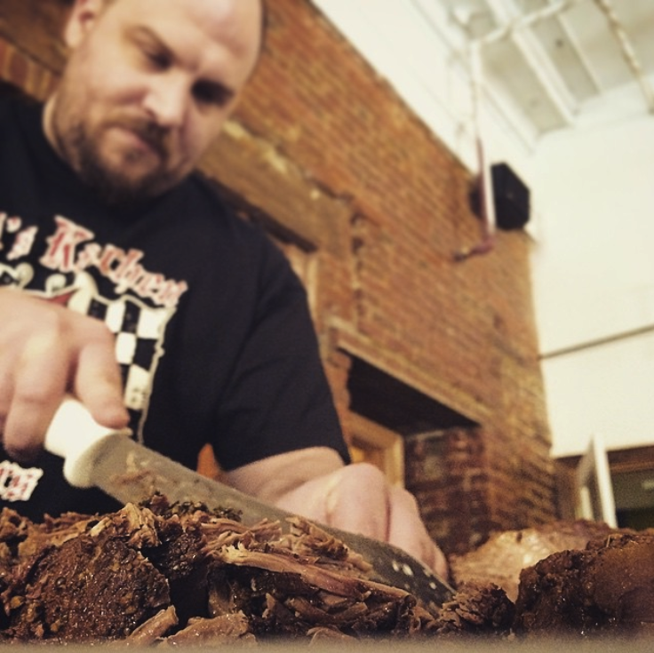 Me carving up a brisket I made for the office. Sometimes hiring me is tasty.
